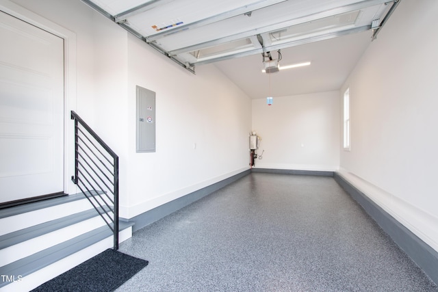 garage with electric panel and a garage door opener