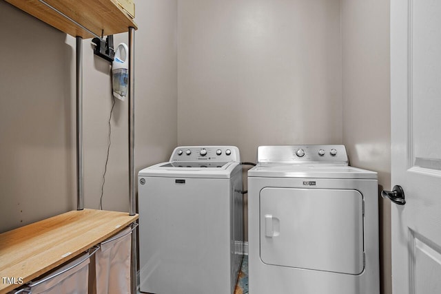 laundry room with washer and dryer