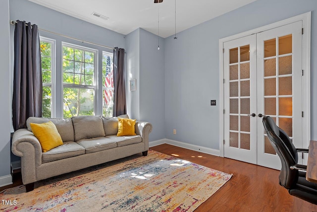 living room featuring french doors and hardwood / wood-style flooring