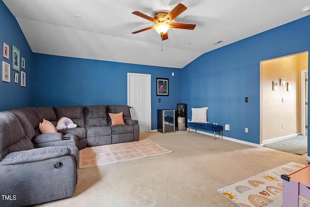 carpeted living room featuring ceiling fan and lofted ceiling