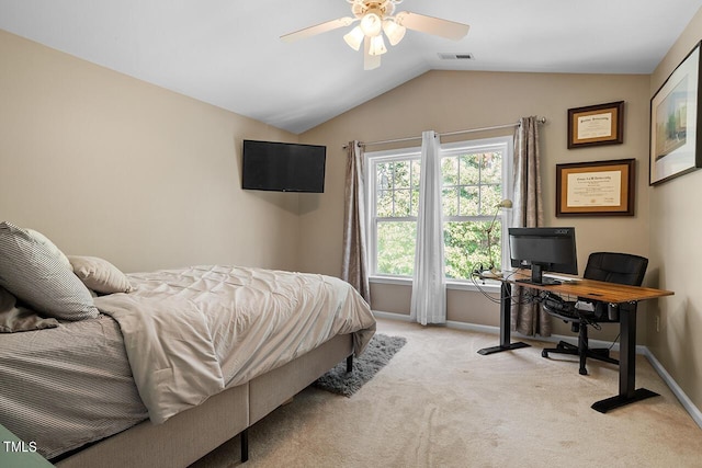 bedroom with ceiling fan, lofted ceiling, and light carpet