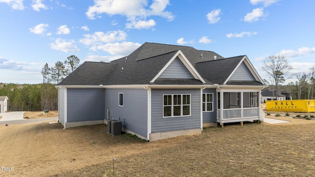 262 Hook Dr Lot 12, Fuquay Varina, NC 27526 - back of property with a sunroom, roof with shingles, and a lawn