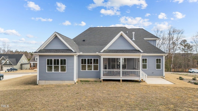 262 Hook Dr Lot 12, Fuquay Varina, NC 27526 - rear view of property with roof with shingles, a sunroom, and a yard