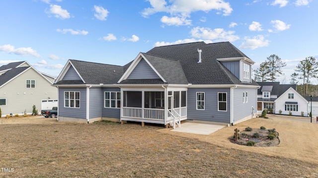 262 Hook Dr Lot 12, Fuquay Varina, NC 27526 - back of house with a sunroom, a patio area, a shingled roof, and a lawn