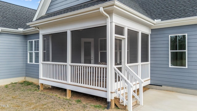 262 Hook Dr Lot 12, Fuquay Varina, NC 27526 - view of side of home featuring a shingled roof and a sunroom