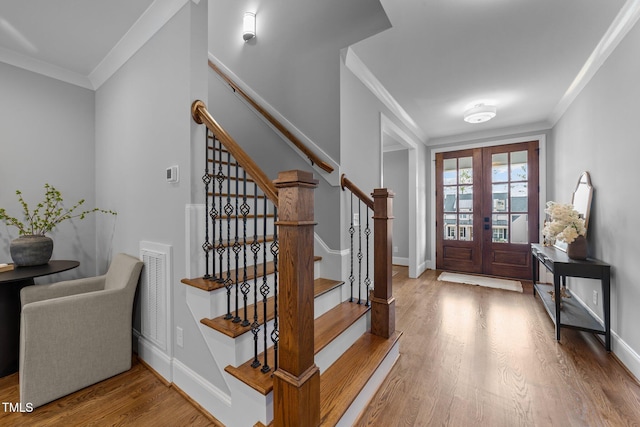 262 Hook Dr Lot 12, Fuquay Varina, NC 27526 - entryway with ornamental molding, wood finished floors, french doors, stairs, and baseboards