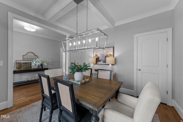 262 Hook Dr Lot 12, Fuquay Varina, NC 27526 - dining space with wood finished floors, a chandelier, beam ceiling, baseboards, and ornamental molding