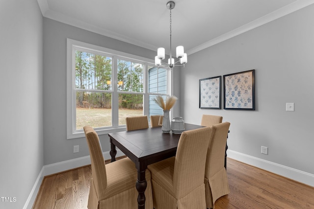 262 Hook Dr Lot 12, Fuquay Varina, NC 27526 - dining room with crown molding, a chandelier, baseboards, and wood finished floors