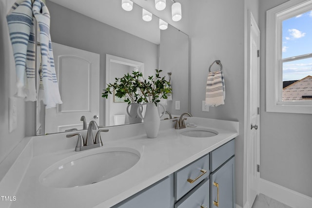 262 Hook Dr Lot 12, Fuquay Varina, NC 27526 - full bath with double vanity, marble finish flooring, and baseboards