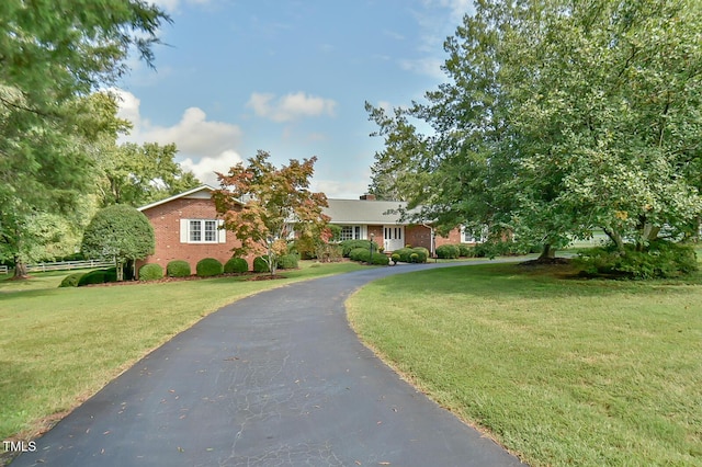 view of front of home with a front lawn