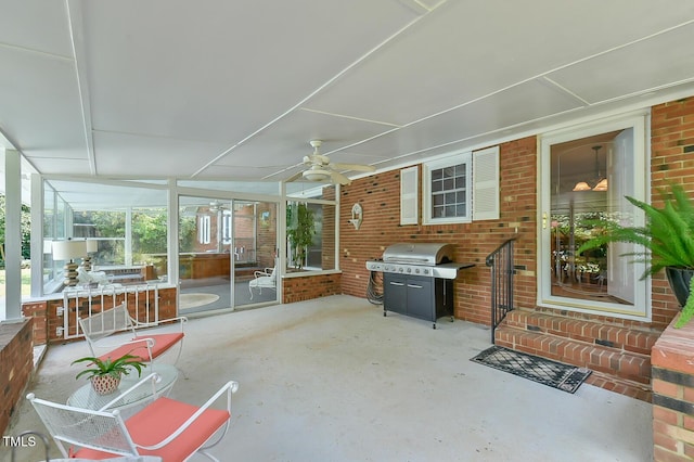 304 Homestead Rd Rd, Chapel Hill, NC 27516 - sunroom featuring ceiling fan, concrete flooring, brick wall, area for grilling, and entry steps