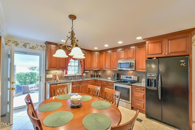 304 Homestead Rd Rd, Chapel Hill, NC 27516 - kitchen with appliances with stainless steel finishes, decorative backsplash, brown cabinets, and recessed lighting