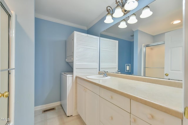 304 Homestead Rd Rd, Chapel Hill, NC 27516 - bathroom featuring stacked washer / dryer, a stall shower, crown molding, and vanity