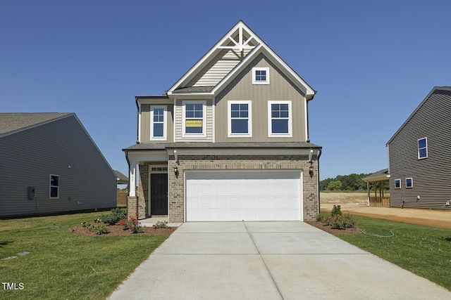 craftsman house with a garage and a front yard