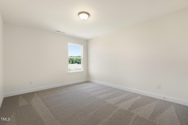 unfurnished room featuring carpet flooring