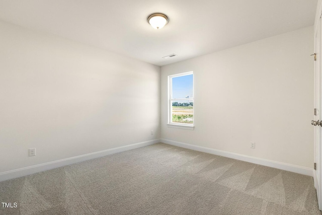 spare room featuring carpet flooring