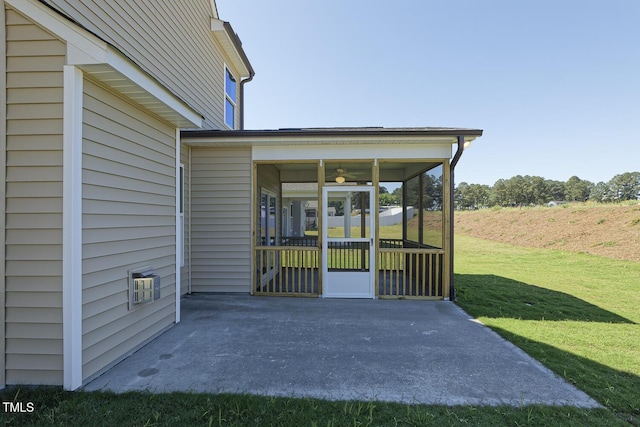 view of patio featuring a sunroom