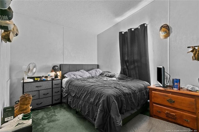 bedroom with a textured ceiling, dark carpet, and lofted ceiling