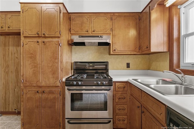5027 Lake Willett Rd, Sanford, NC 27332 - kitchen featuring a sink, brown cabinets, dishwasher, range hood, and gas stove