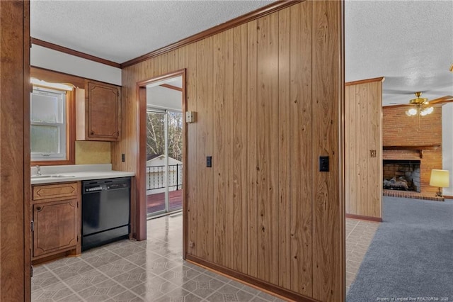 5027 Lake Willett Rd, Sanford, NC 27332 - kitchen with dishwasher, wood walls, crown molding, and a textured ceiling