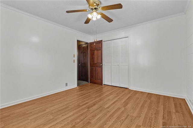 5027 Lake Willett Rd, Sanford, NC 27332 - unfurnished bedroom featuring light wood-style flooring, a closet, ceiling fan, and ornamental molding