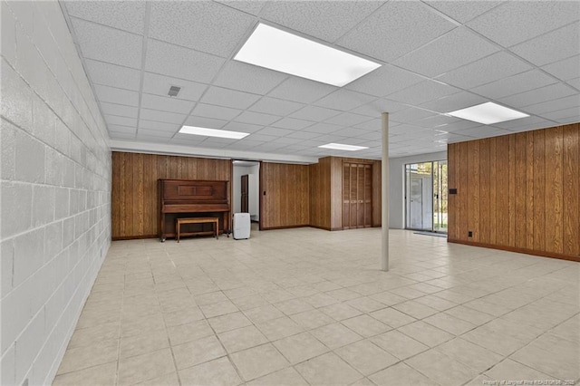 5027 Lake Willett Rd, Sanford, NC 27332 - basement featuring concrete block wall, wood walls, and light floors