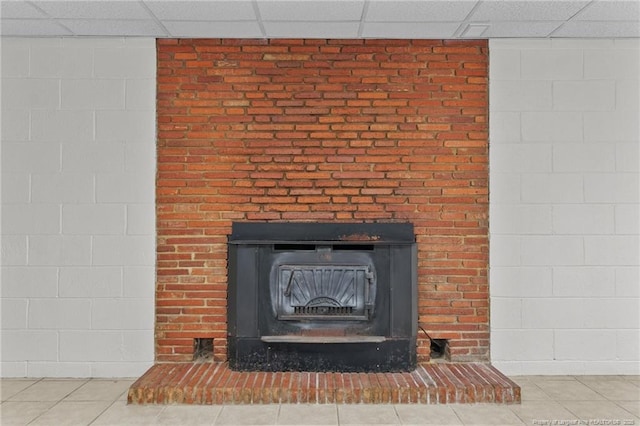 5027 Lake Willett Rd, Sanford, NC 27332 - room details featuring a wood stove and a drop ceiling