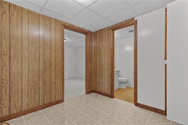 5027 Lake Willett Rd, Sanford, NC 27332 - spare room featuring a paneled ceiling and wooden walls
