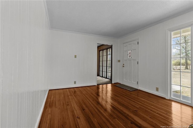 5027 Lake Willett Rd, Sanford, NC 27332 - interior space featuring baseboards, a textured ceiling, ornamental molding, and wood-type flooring