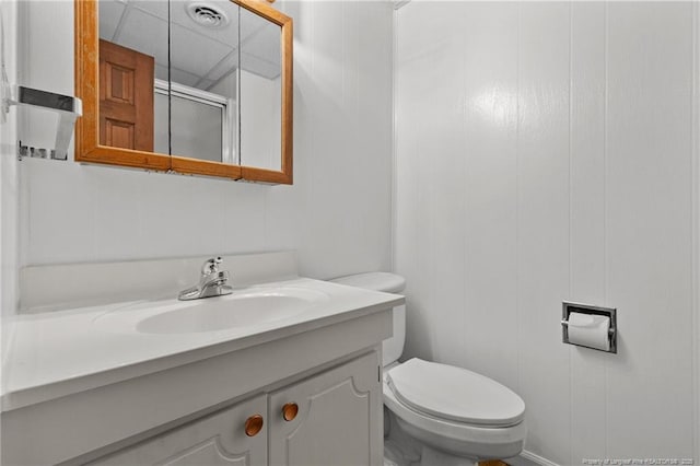 5027 Lake Willett Rd, Sanford, NC 27332 - bathroom with visible vents, vanity, a shower stall, and toilet