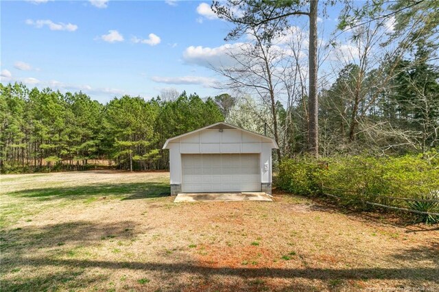 5027 Lake Willett Rd, Sanford, NC 27332 - detached garage featuring a wooded view