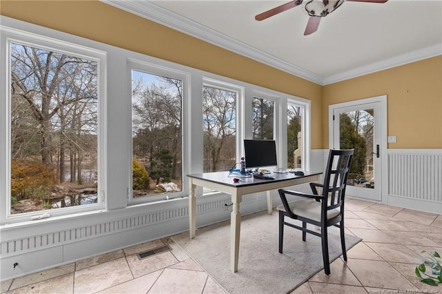 sunroom / solarium with a healthy amount of sunlight and ceiling fan