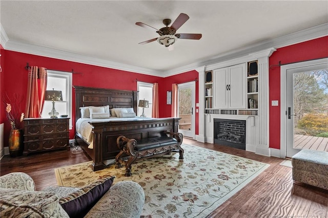 bedroom featuring ceiling fan, dark wood-type flooring, access to outside, and ornamental molding