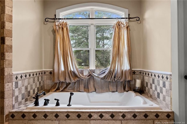 bathroom with tiled bath