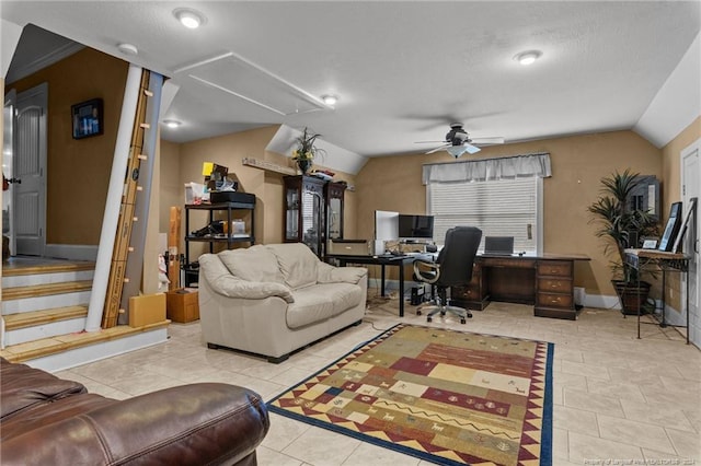 living room featuring ceiling fan, light tile floors, and lofted ceiling