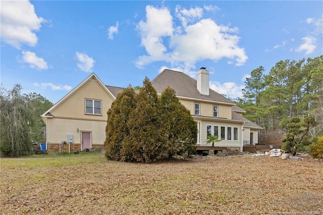 view of side of property featuring a deck