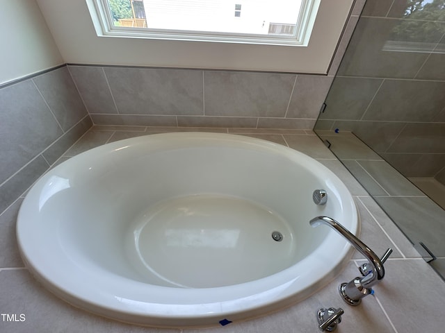 bathroom with a garden tub