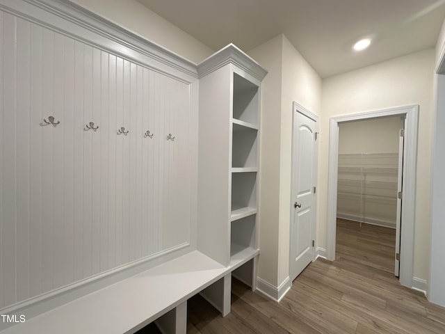 mudroom featuring baseboards, wood finished floors, and recessed lighting