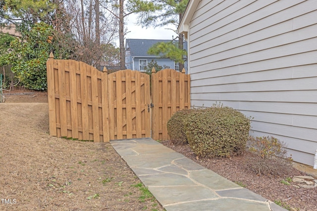 view of gate featuring fence