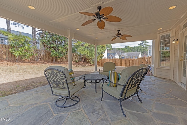 view of patio with a fenced backyard and ceiling fan