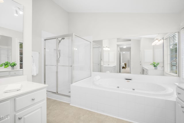 full bath with a stall shower, a jetted tub, and two vanities