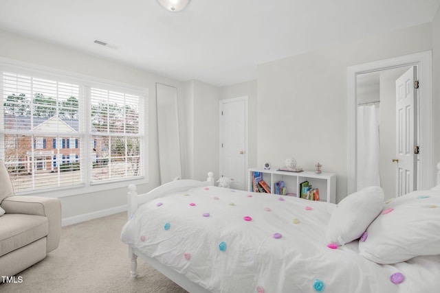 bedroom with visible vents, baseboards, and carpet flooring