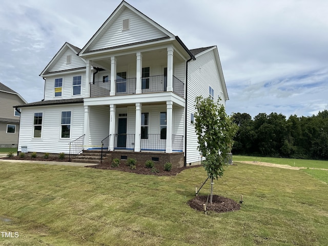 greek revival house featuring crawl space, covered porch, a balcony, and a front lawn