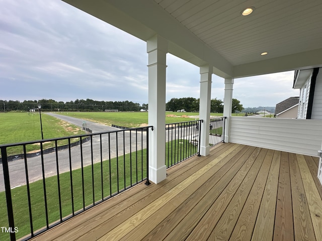 wooden deck with a yard