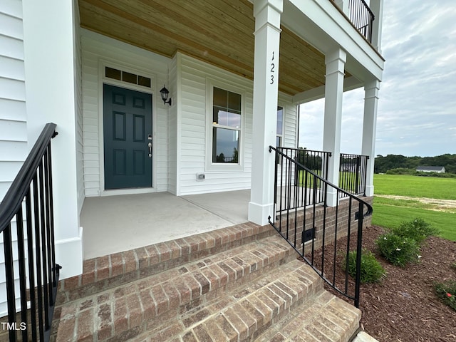 doorway to property featuring covered porch