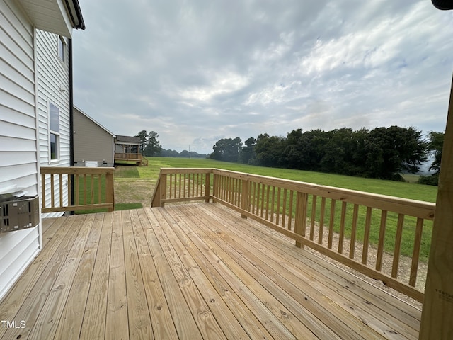 deck featuring a lawn