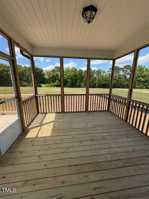 123 Sage Ln Unit 010, Four Oaks, NC 27524 - wooden terrace featuring view of wooded area