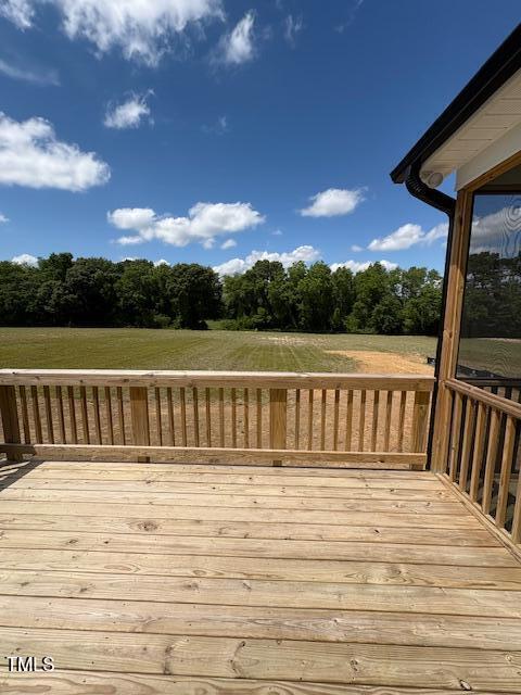 123 Sage Ln Unit 010, Four Oaks, NC 27524 - wooden terrace with view of scattered trees