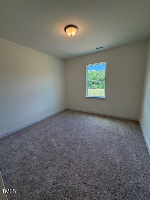 123 Sage Ln Unit 010, Four Oaks, NC 27524 - spare room featuring baseboards and carpet flooring
