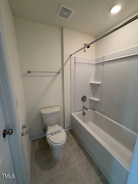 123 Sage Ln Unit 010, Four Oaks, NC 27524 - bathroom featuring toilet, tile patterned floors, shower / bathtub combination, and baseboards